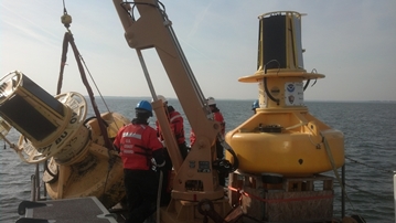 Old and new SR buoys on deck of Coast Guard buoy tender